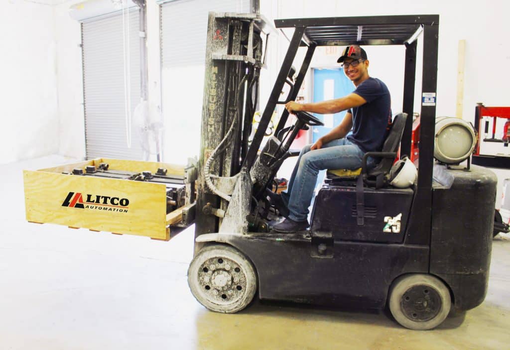 Litco Automation employee preparing industrial equipment for shipment